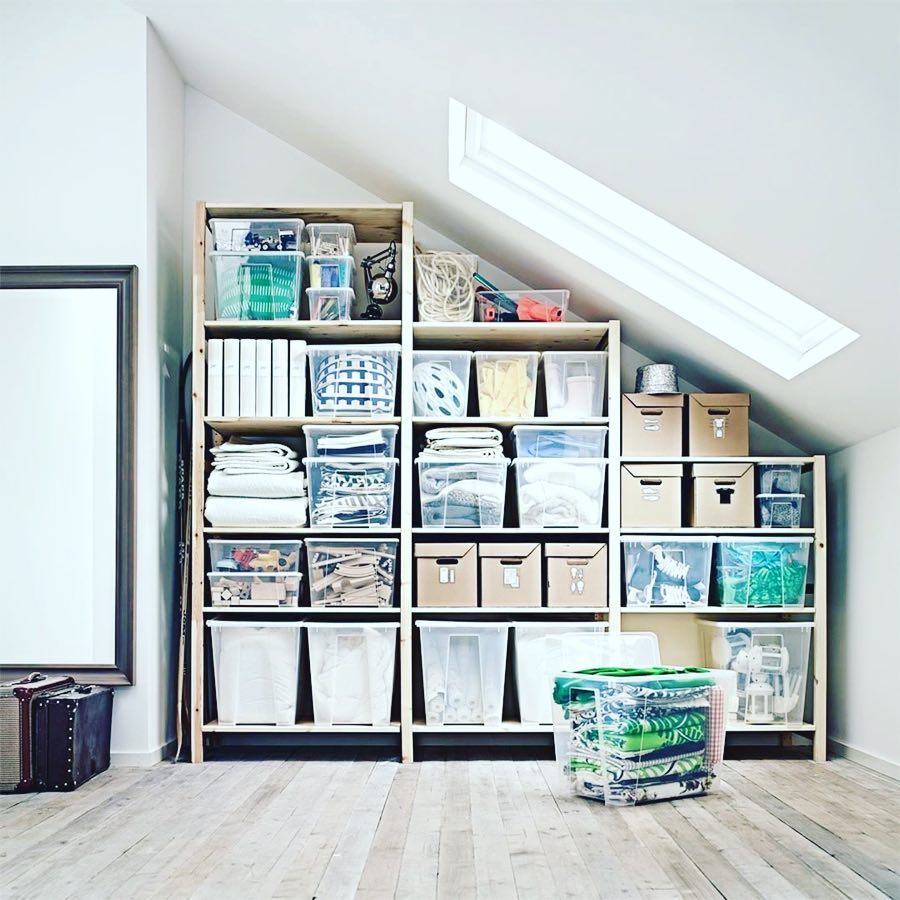 Attic Storage Space with Wooden Shelves and Clear Totes. Photo by Instagram user @inordertosucceed