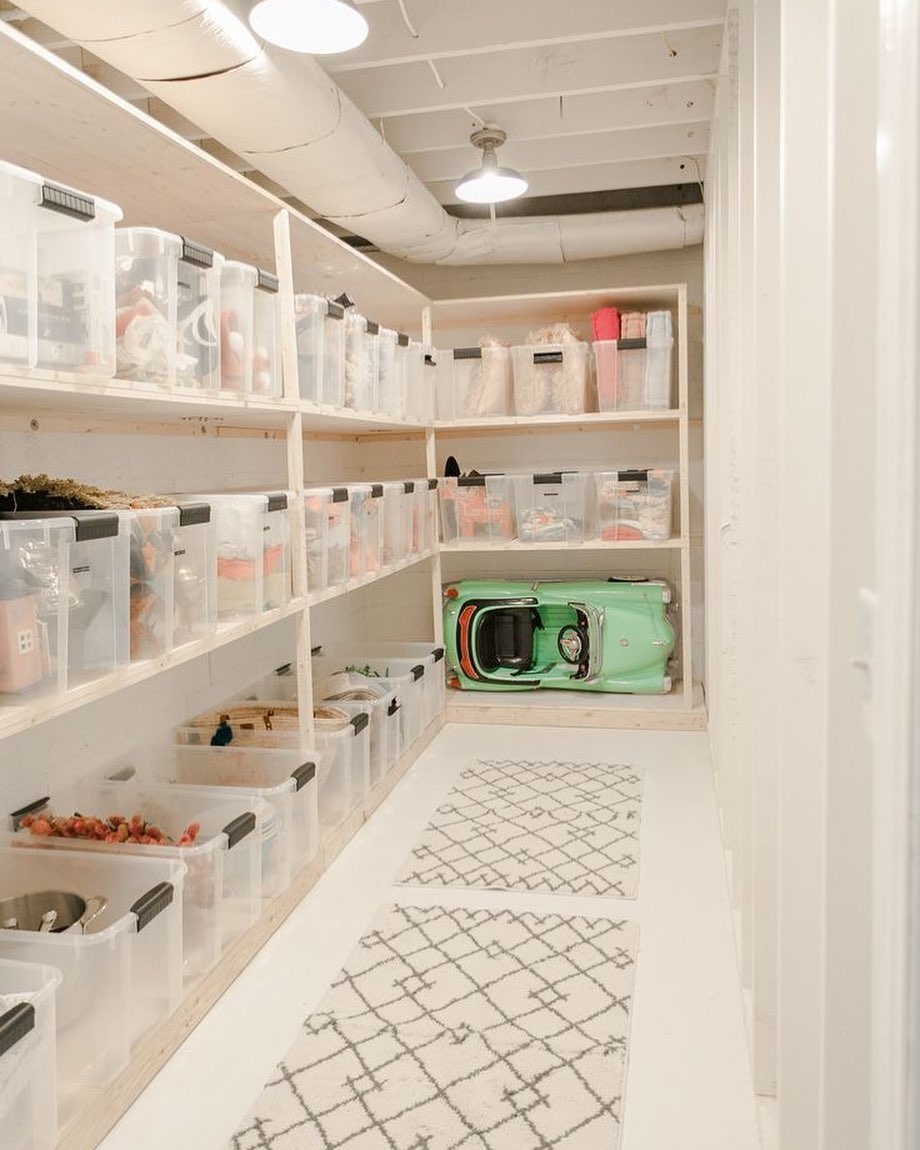 Basement Storage Space Filled with Clear Totes on Shelves. Photo by Instagram user @dwell.organized