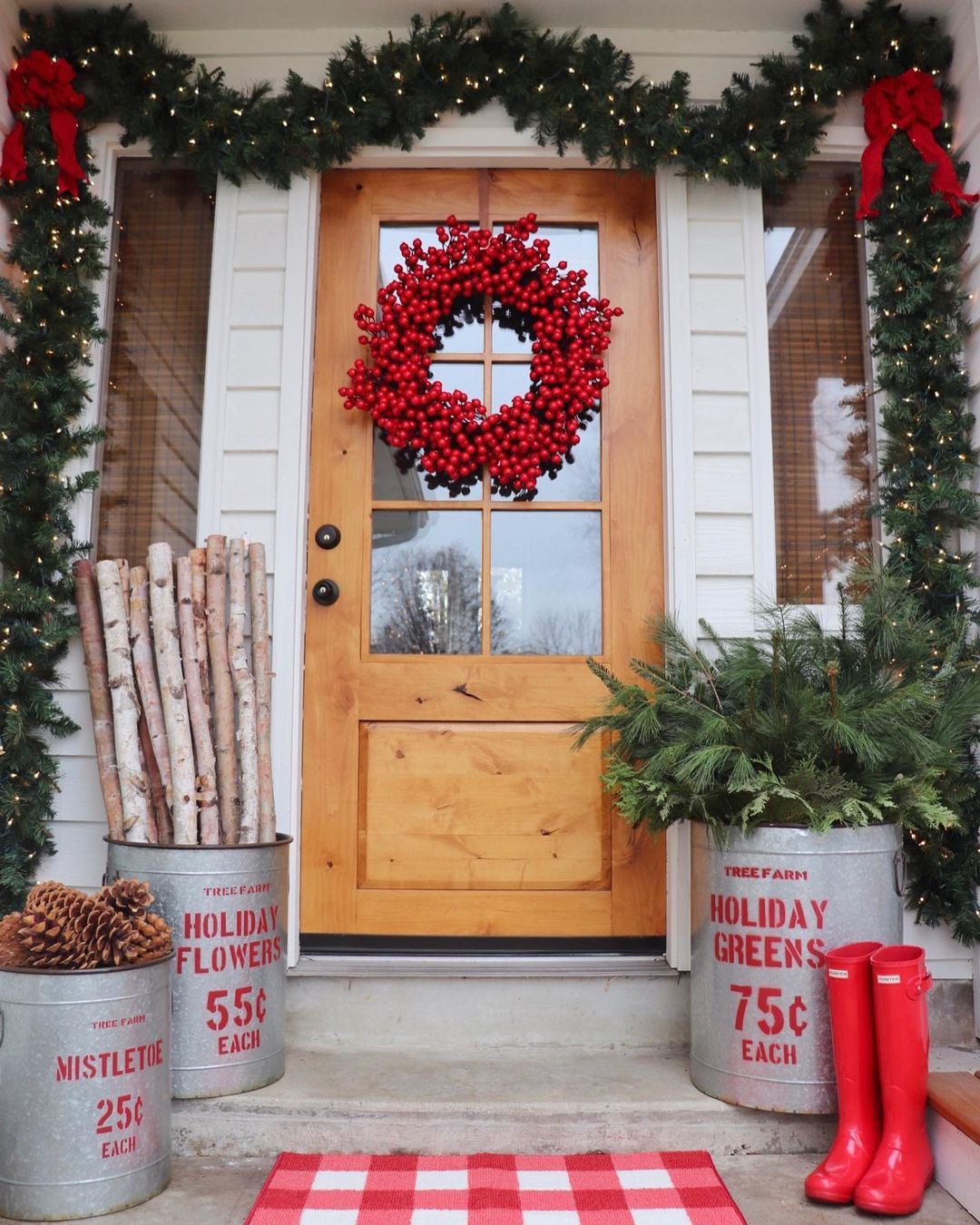Large wreath made of cranberries hanging on a front door. Photo by @randilynnblog.