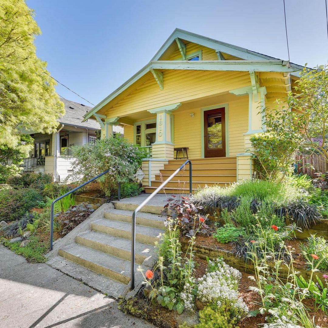 Older Craftsman Style Home Painted Yellow in Richmond, Portland. Photo by Instagram user @dcgpdx