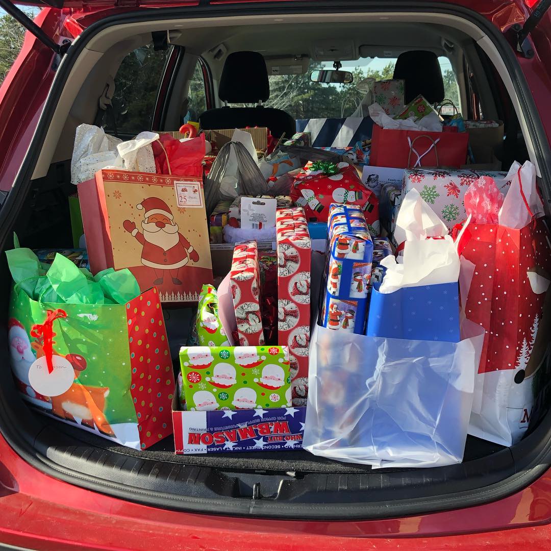 Lots of Wrapped Presents in the Back of a Car. Photo by Instagram user @the_adventures_of_saraht