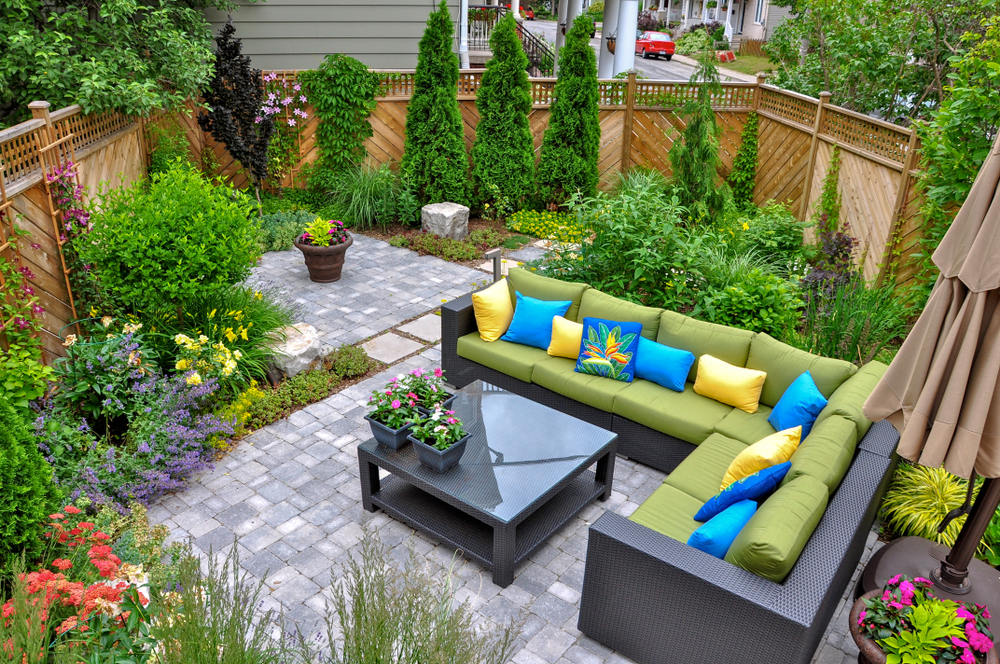 Small Backyard with Large Outdoor Seating Are and Paver Patio