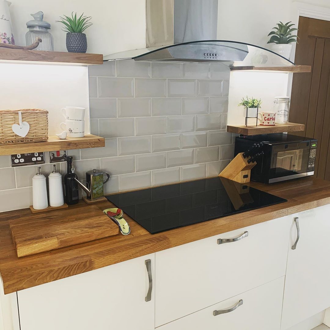 Updated Kitchen with Induction Cooktop on Wooden Counters. Photo by Instagram user @the_peacocks_and_the_pines