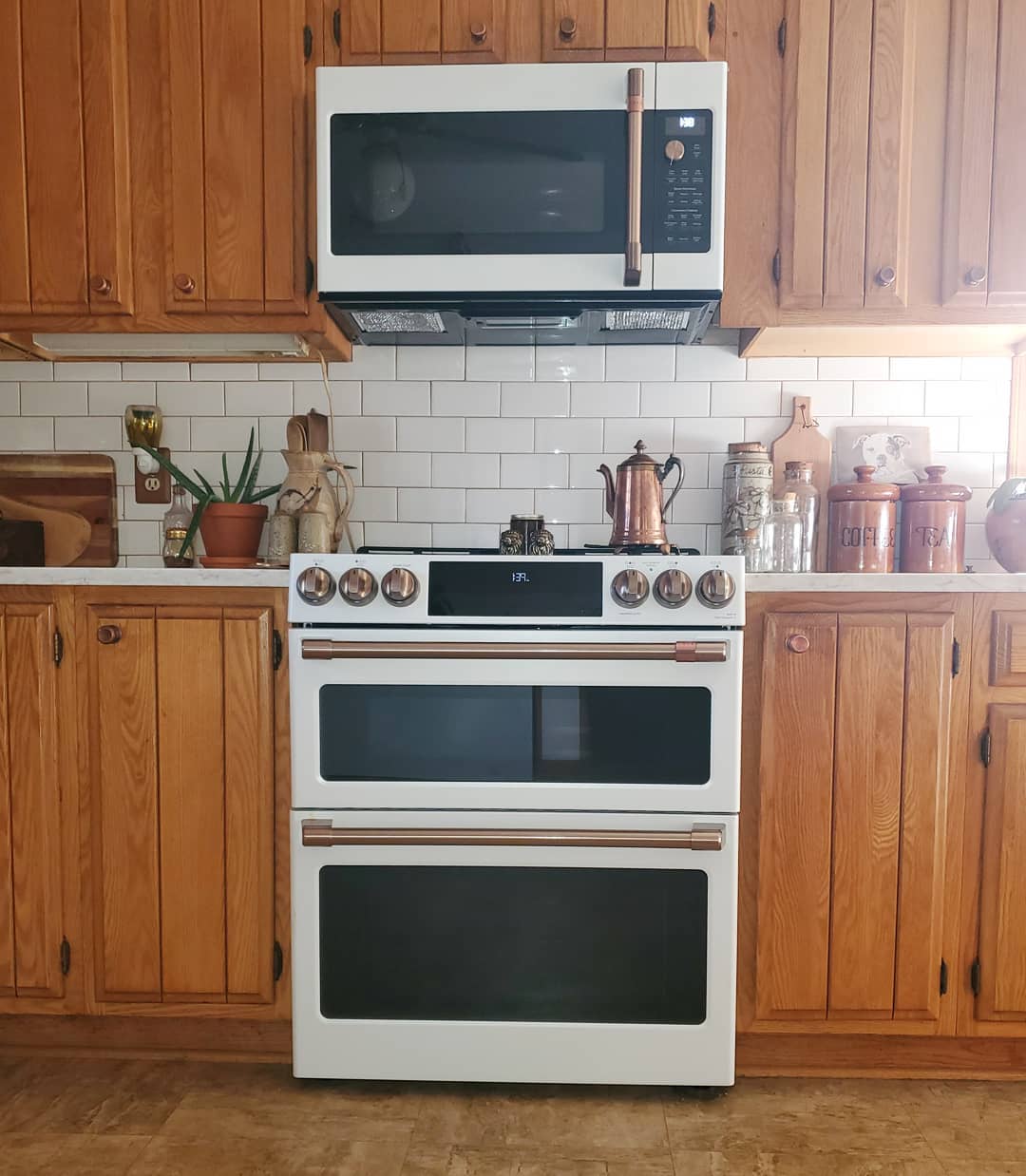 Updated Appliances in Older Kitchen with Energy Efficient Microwave. Photo by Instagram user @nickalena__
