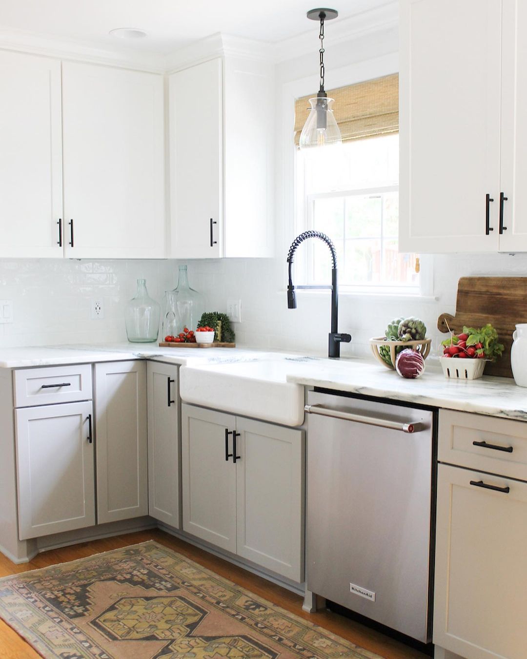 Updated Kitchen with Refaced White Cabinets with Black Pulls. Photo by Instagram user @melissawhitted.interiors