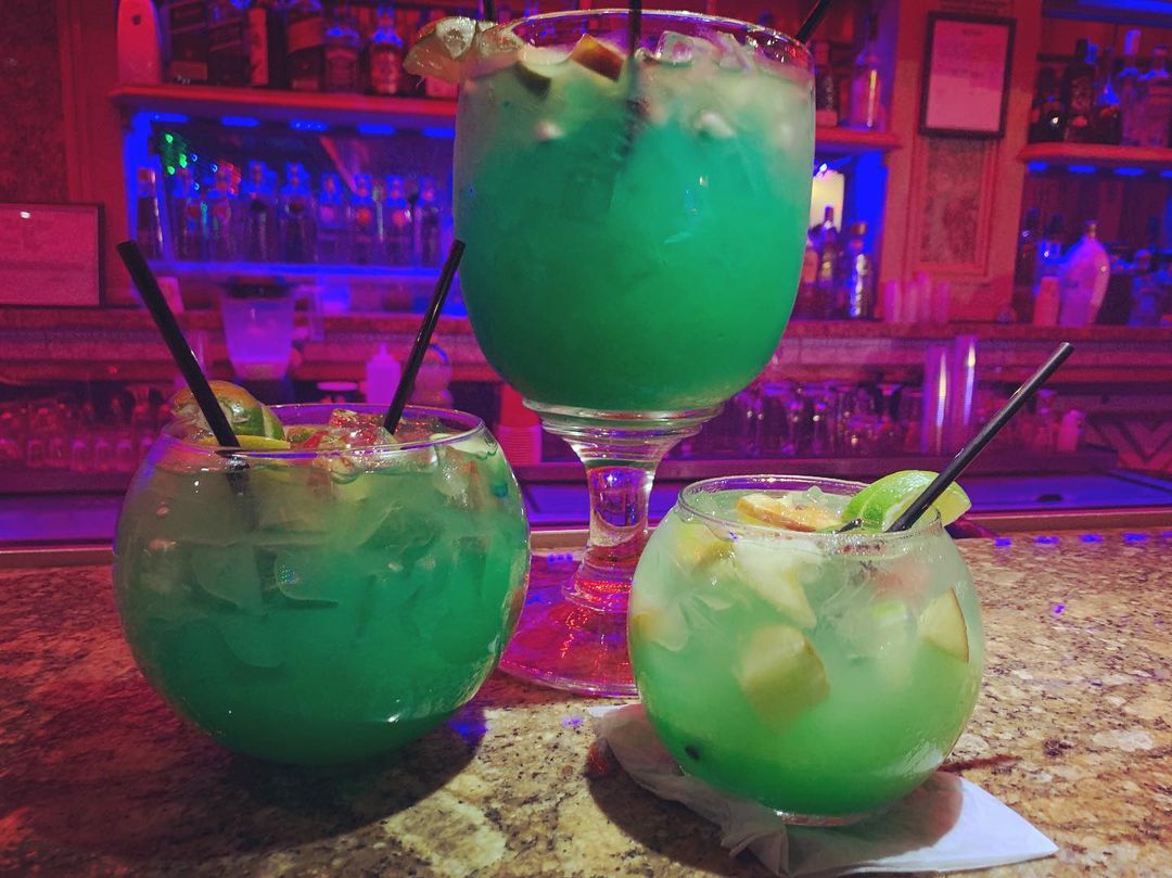 Three glasses of differing sizes of a green cocktail at Infinity Lounge NJ. Photo by Instagram user @infinityloungenj