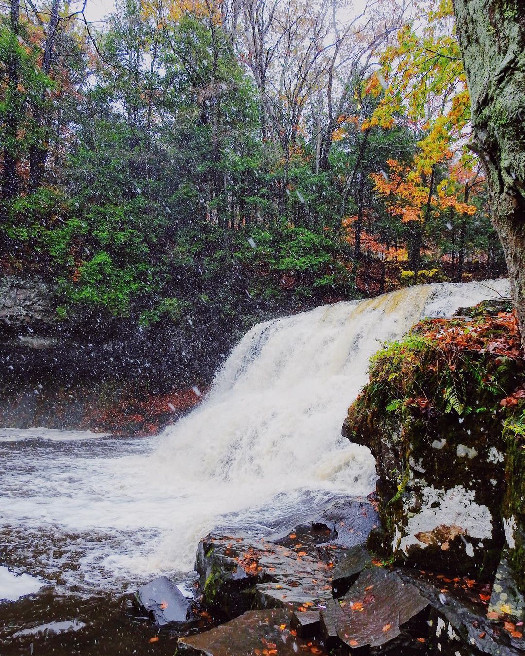 Small waterfall during early snowfall in the autumn at Wadsworth Falls State Park. Photo by Instagram user @alexjwphotography.