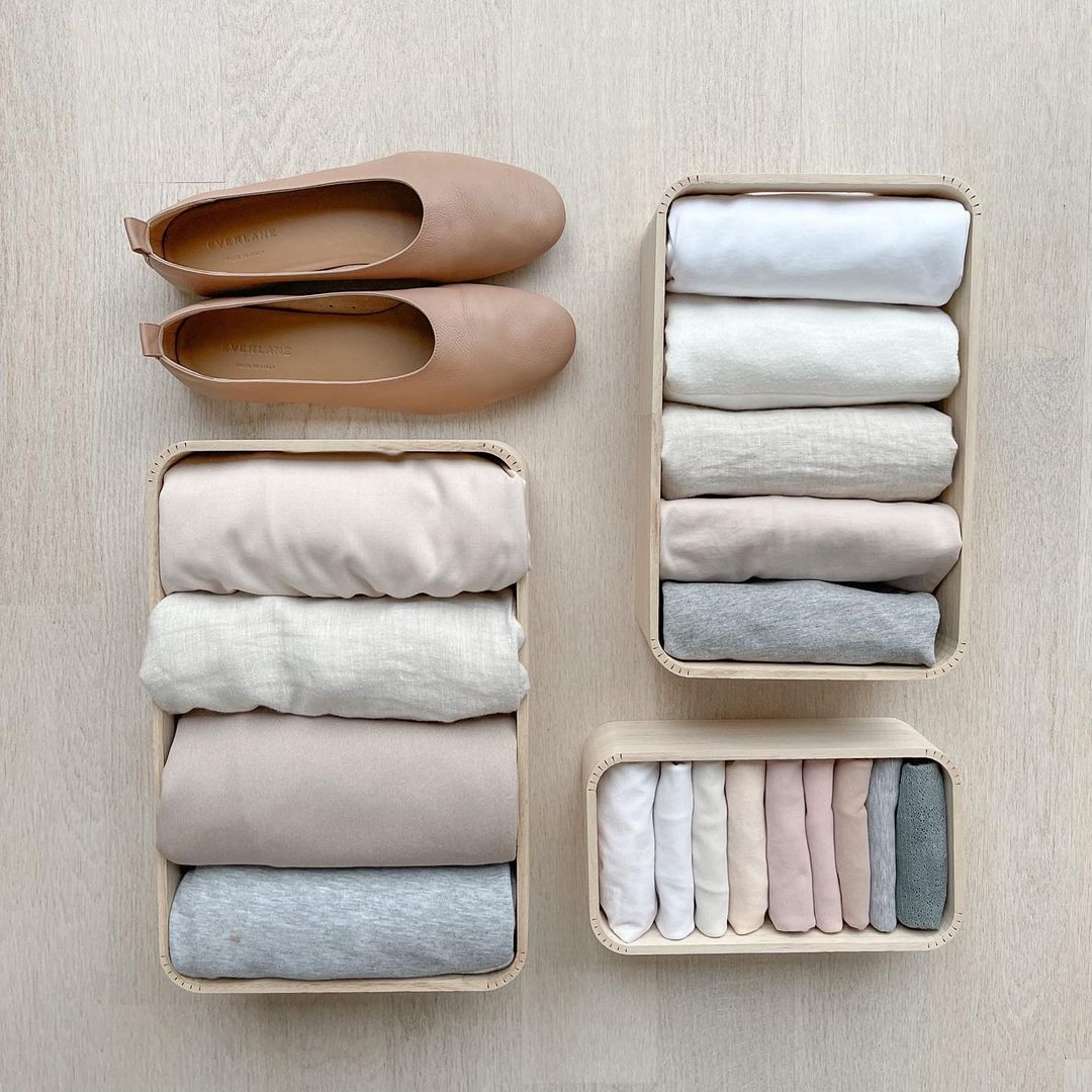 Minimalist Clothing in Small Baskets. Photo by Instagram user @minimalistmeblog
