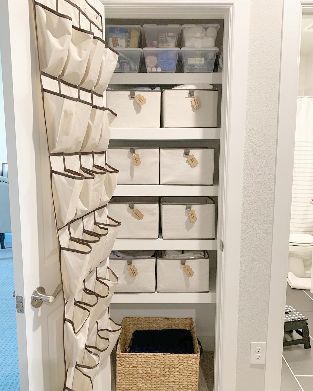Neatly Organized Linen Closet with Bins for Everything. Photo by Instagram user @libbyandlabels