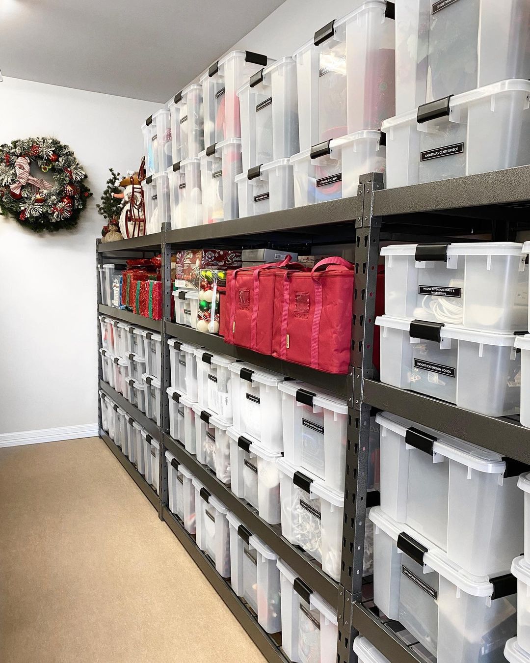Clean and Organized Storage Room with Clear Totes on Shelves. Photo by Instagram user @theorganizingblonde