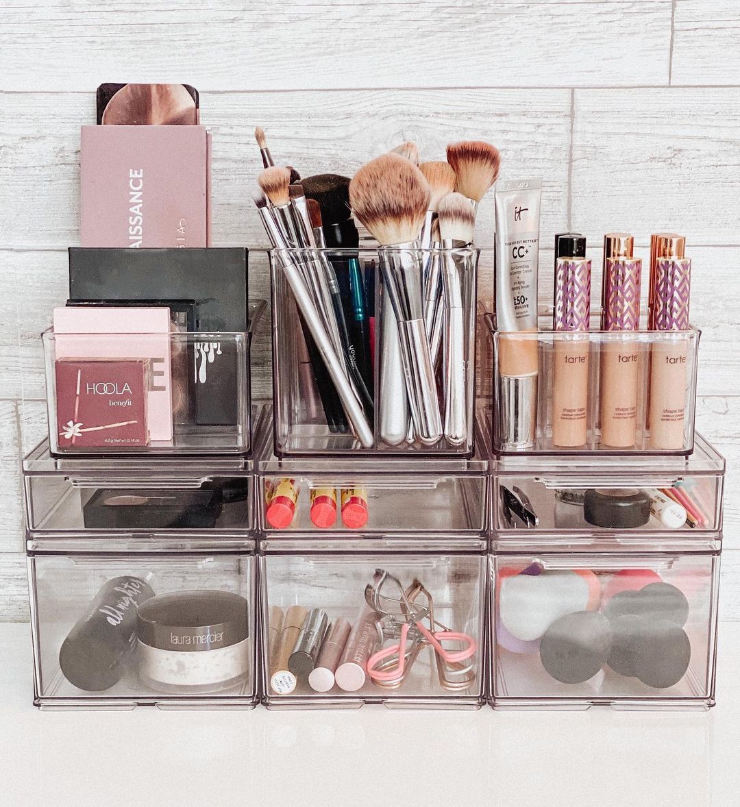 Makeup and makeup tools separated neatly in clear compartments. Photo by Instagram user @neatlyembellished.