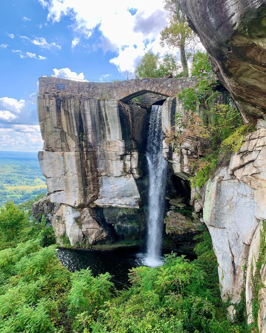 A waterfall runs through Lookout Mountain. Photo by Instagram user @thebookofplaces.