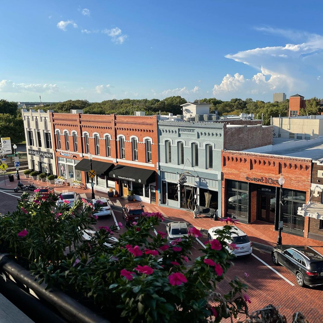 Exterior drone photography of row of businesses in Downtown Plano, Texas 