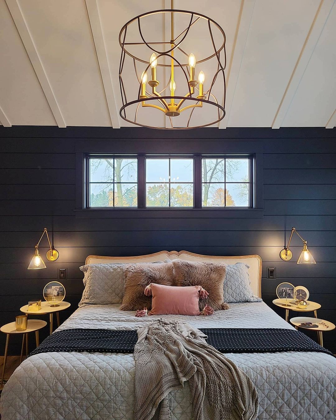 Brass bedroom chandelier and two bedside lamps. Photo by Instagram User @cvi_design