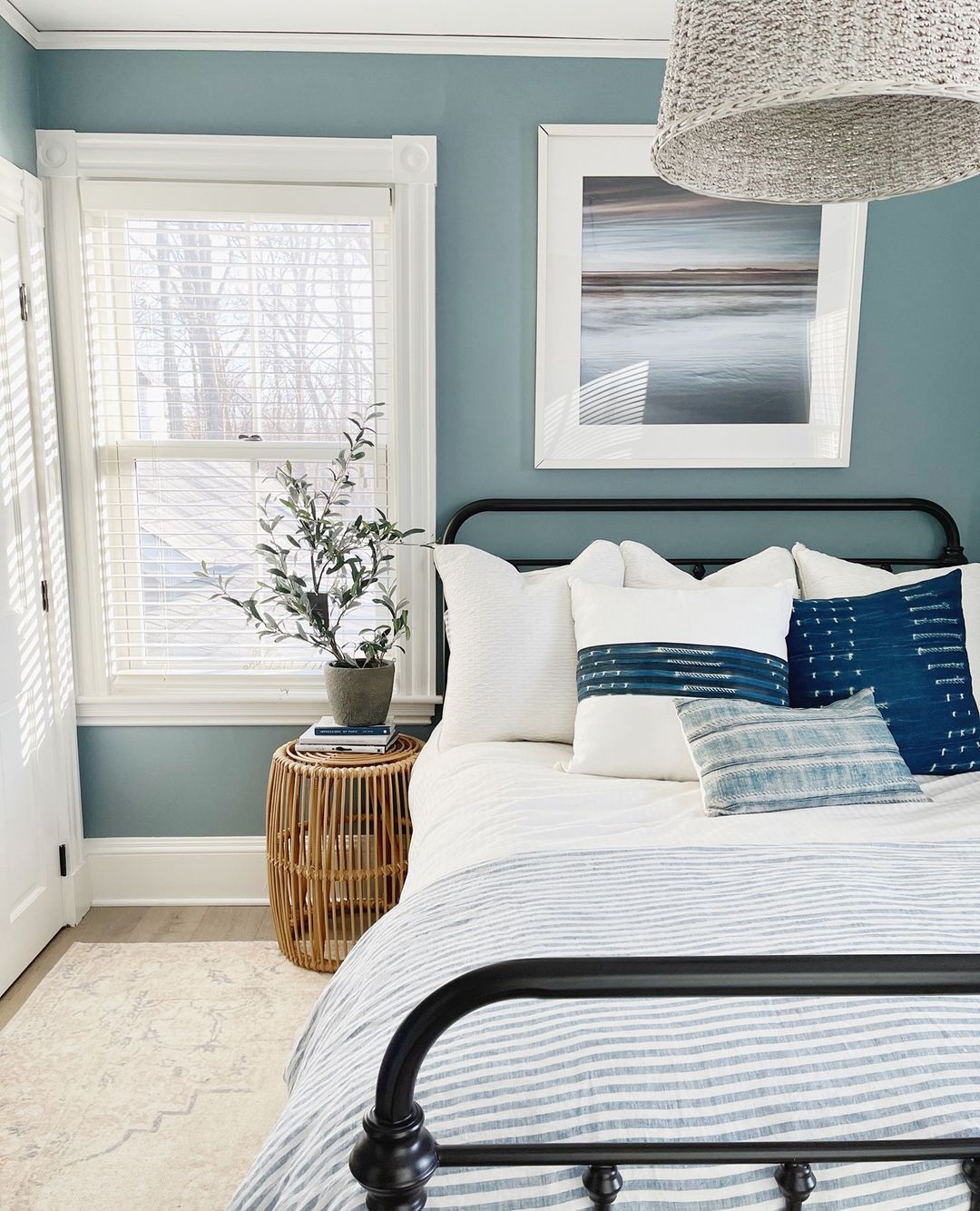 Dusty blue paint color on bedroom wall. Photo by Instagram User @palmandprep