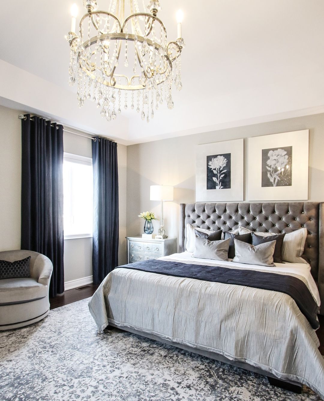 Black curtains hung in chic bedroom. Photo by Instagram User @kimmberlycaponeinteriors