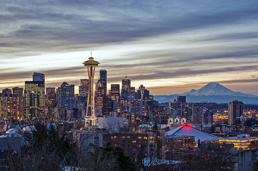 View of downtown Seattle at sundown, Mt Rainier in background. Photo by Instagram user @andrew.bondarchuk