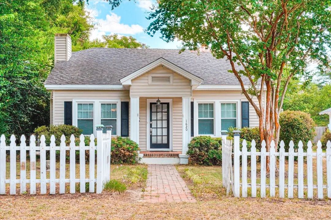 Small ranch style home with a white picket fence in Augusta, Georgia. Photo by Instagram user @daniele.ennis.realestate