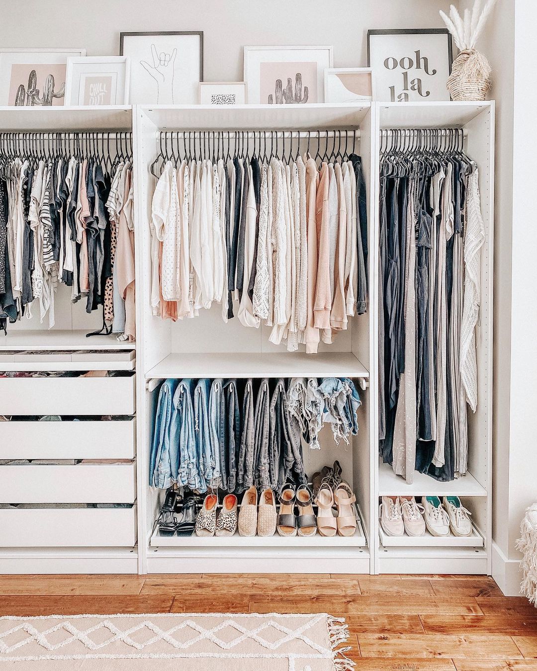 A nicely organized white closet with shoes and clothes. Photo by Instagram user @bymeghang