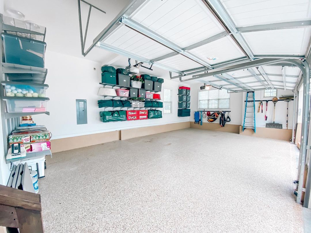 Garage organized with wall-mounted storage bins. Photo by Instagram user @cwhome_charlotte