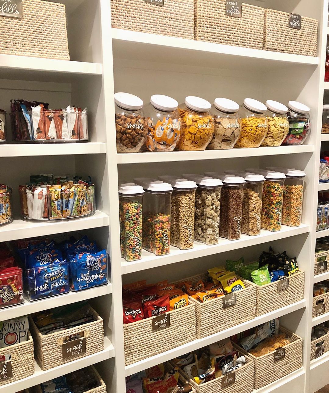 Pantry organized with storage containers and glass canisters. Photo by Instagram user @azhouseoforder