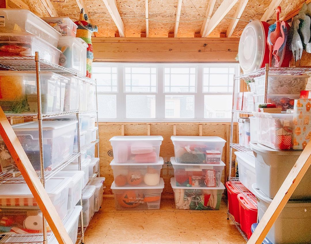Storage room in a house house organized with clear plastic bins. Photo by Instagram user @thetidyhomenashville