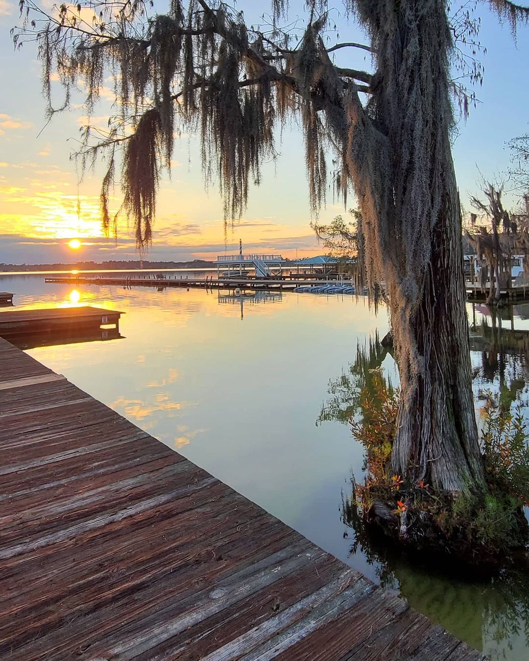 Sunset view from a dock at White Lake in North Carolina. Photo by Instagram user @whitelakejlc