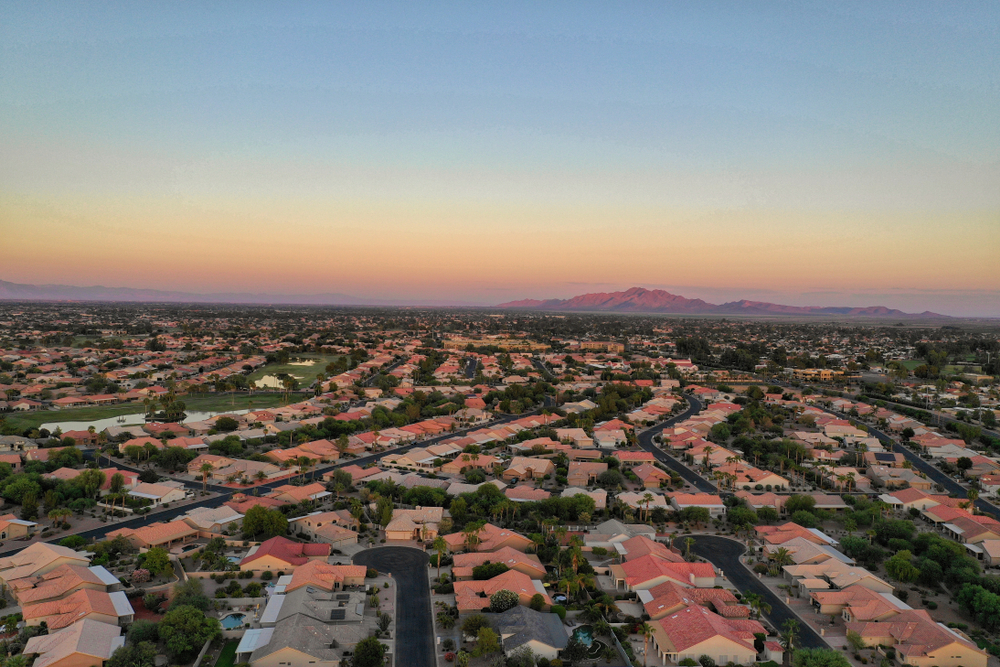 Aerial shot of Chandler, AZ suburbs with mountain view.