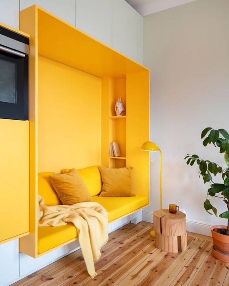 Bright yellow used as a wall color because of its association with happiness and warmth. Photo by Instagram User @jolauriedesign