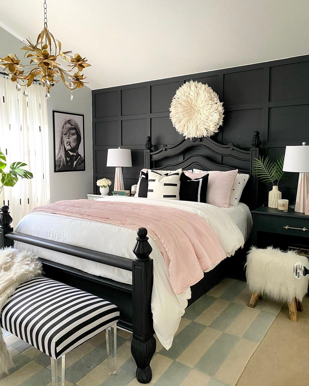 Trendy bedroom with a jet black accent wall.