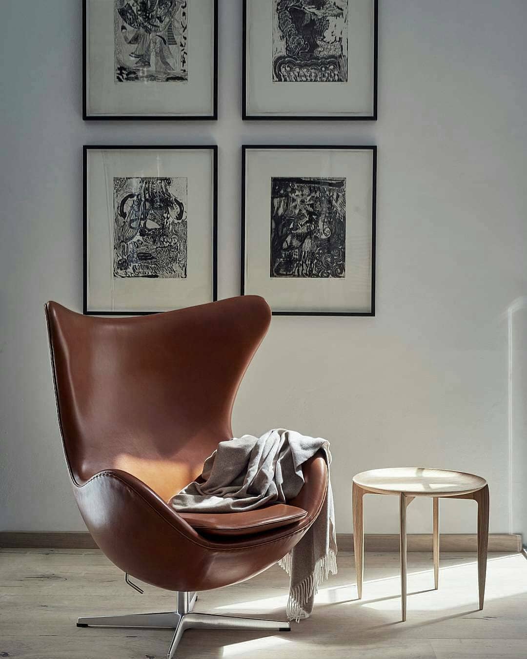 Arne Jacobsen design cognac brown leather egg chair. Photo by Instagram user @dyeowna