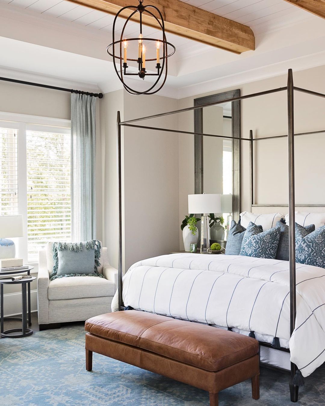 modern four-poster bed in a transitional styled bedroom. Photo by Instagram user @ashleymartinhome