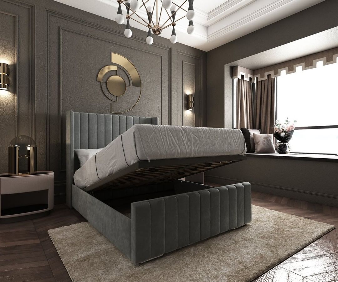 Dark gray upholstered ottoman bed propped open. Photo by Instagram user @bellelivingltd