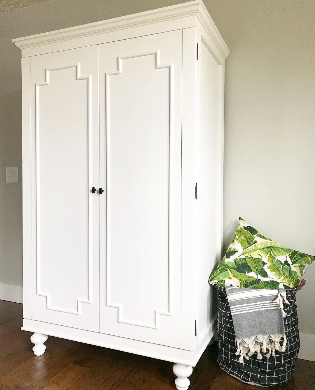White traditional style standalone wardrobe. Photo by Instagram user @woodshopdiaries