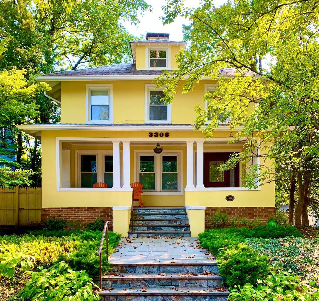Multistory yellow East Coast craftsman style home in DC's Chevy Chase neighborhood. Photo by Instagram user @artyomshmatko
