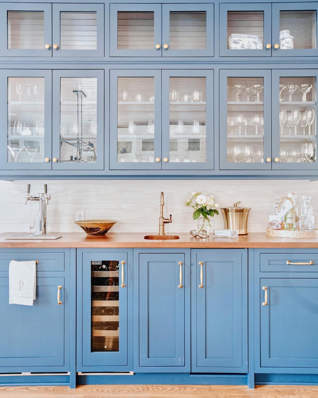 Kitchen with light blue cabinetry and drawers. Photo by Instagram user @loganelizabethdesigns