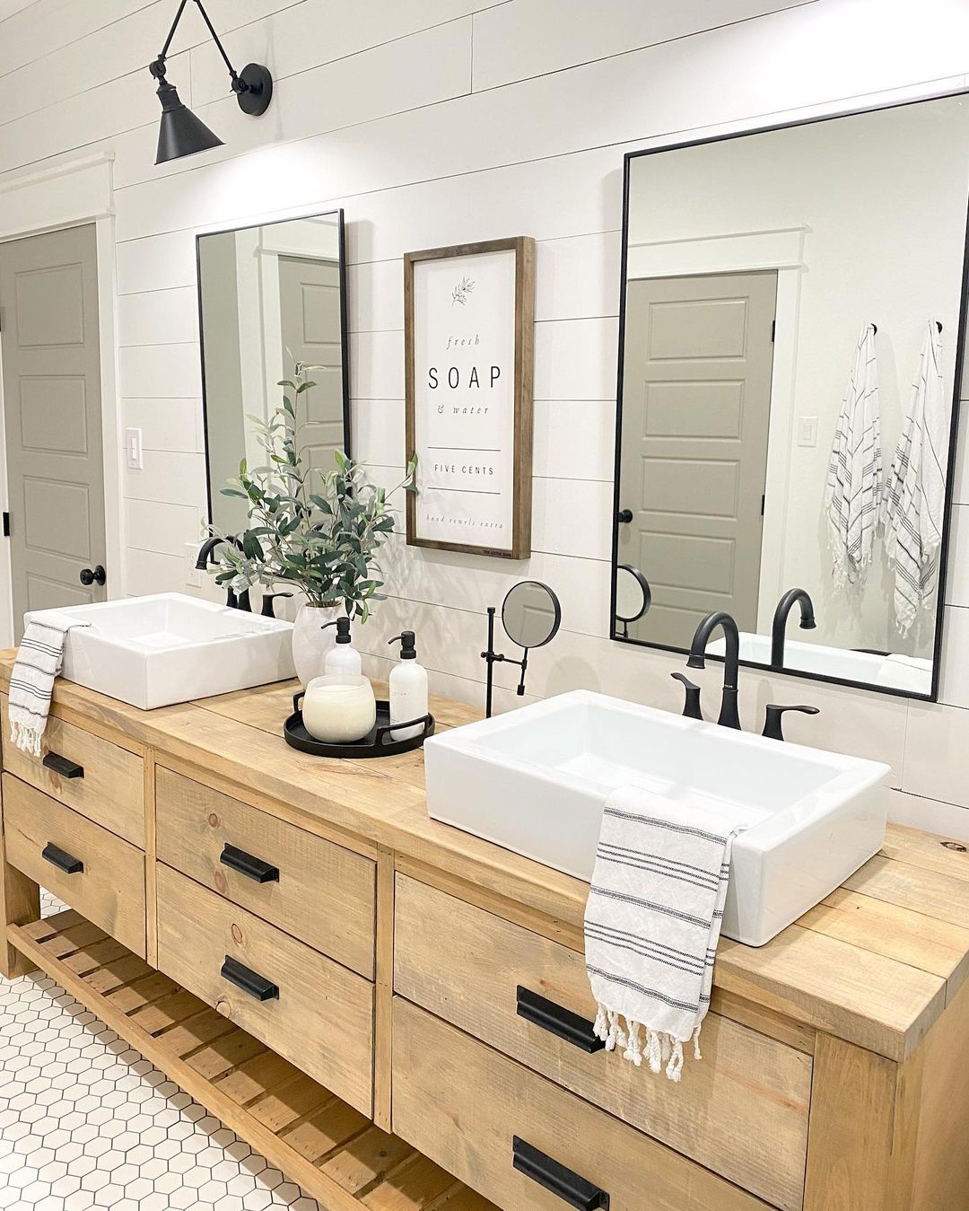 Double bathroom sink with clear counters except a few necessities. Photo by Instagram user @thecozyfarmhouse.