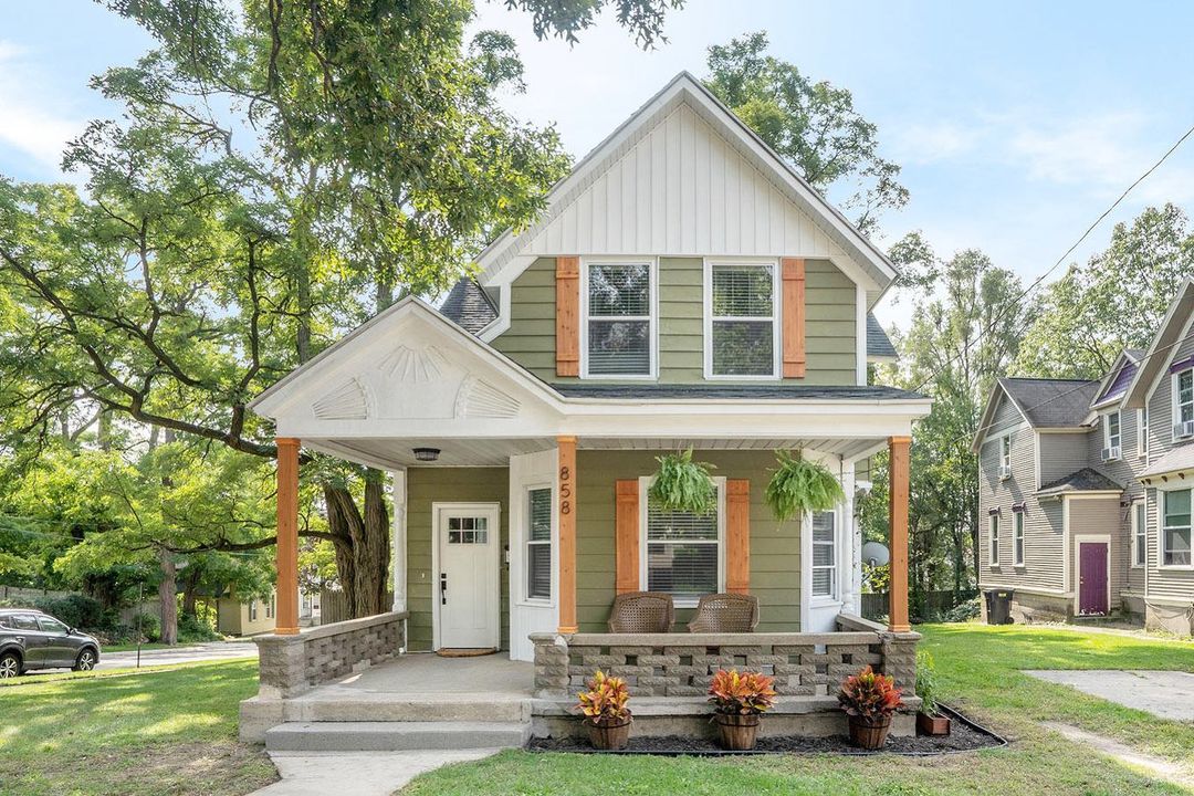 Sage Craftsman home with natural wood accents in Eastown neighborhood of Grand Rapids. Photo by Instagram user @besthomesofgr.