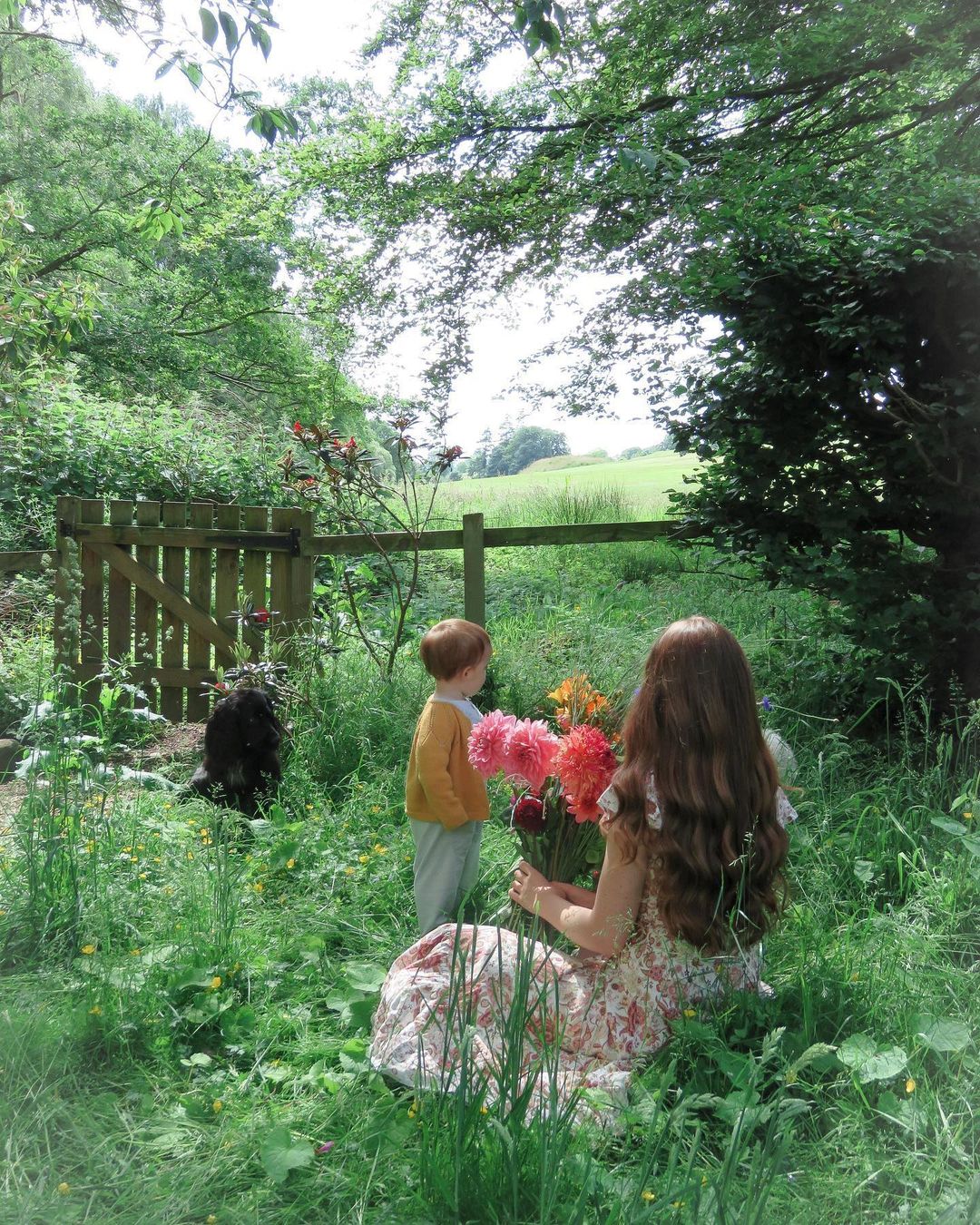 Woman in a Garden with a Young Child. Photo by Instagram user @thelittlepinkcottage_