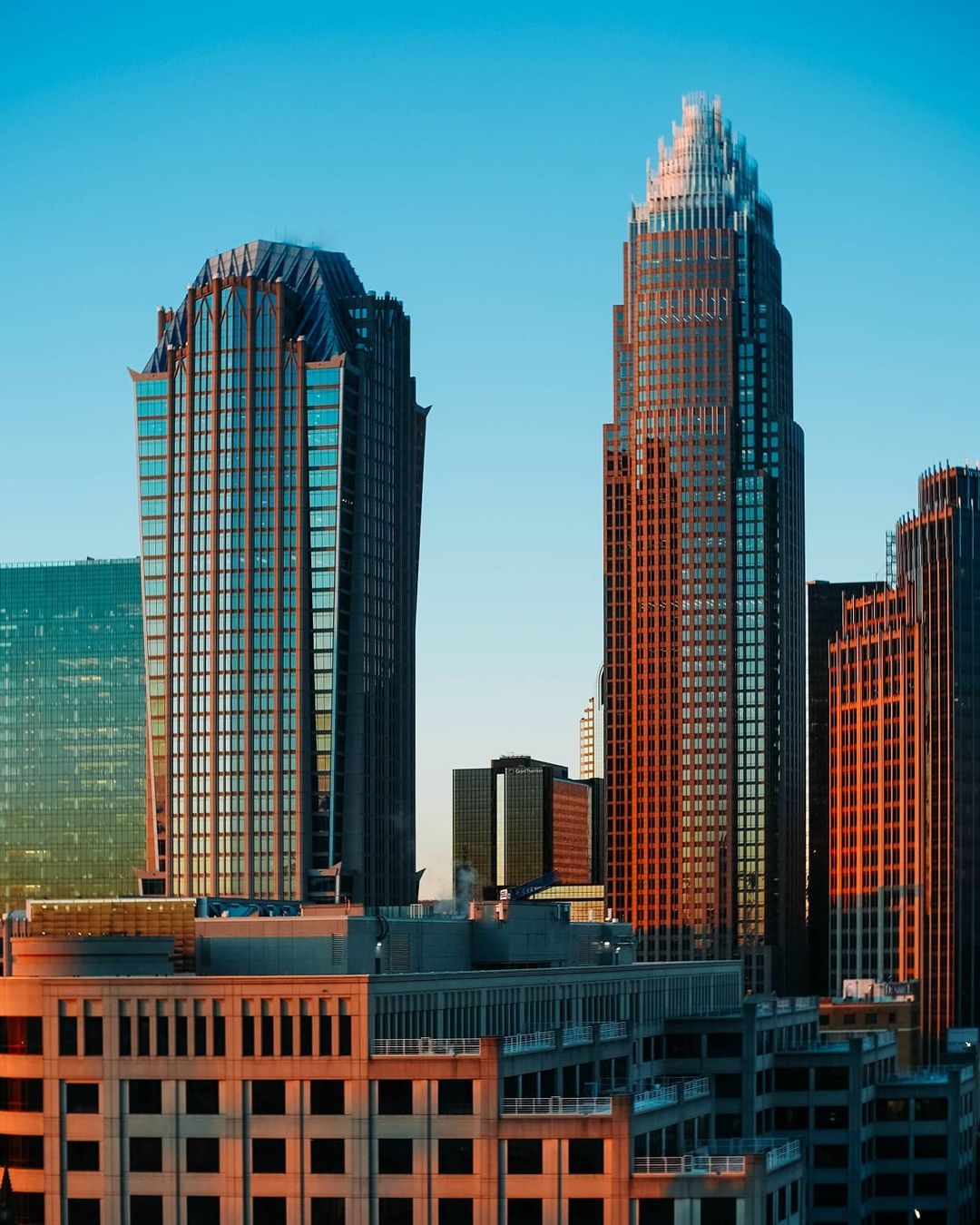 Skyline photo with tall buildings in Uptown Charlotte. Photo by Instagram User @thejairoherrera