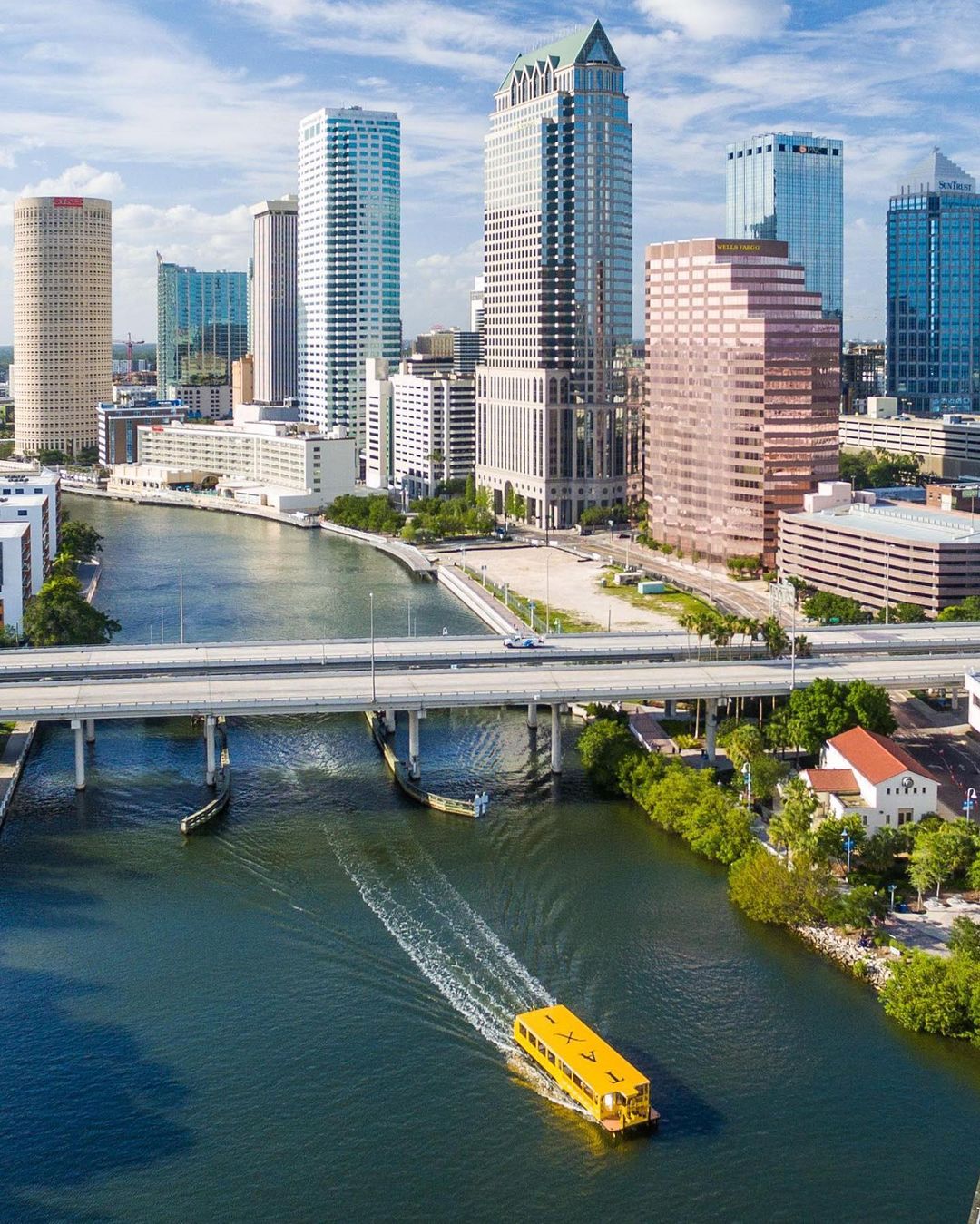 Skyline photo of Downtown Tampa and Tampa Bay with boat on it. Photo by Instagram User @visittampabay