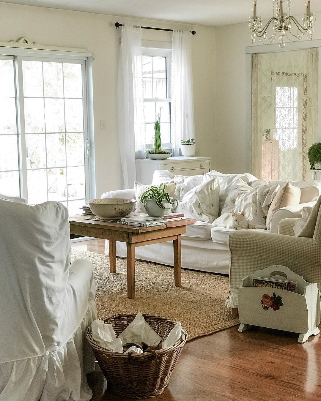 Cottagecore Style Home with White Cat Lying on White Couch. Photo by Instagram user @tracey_hiebert