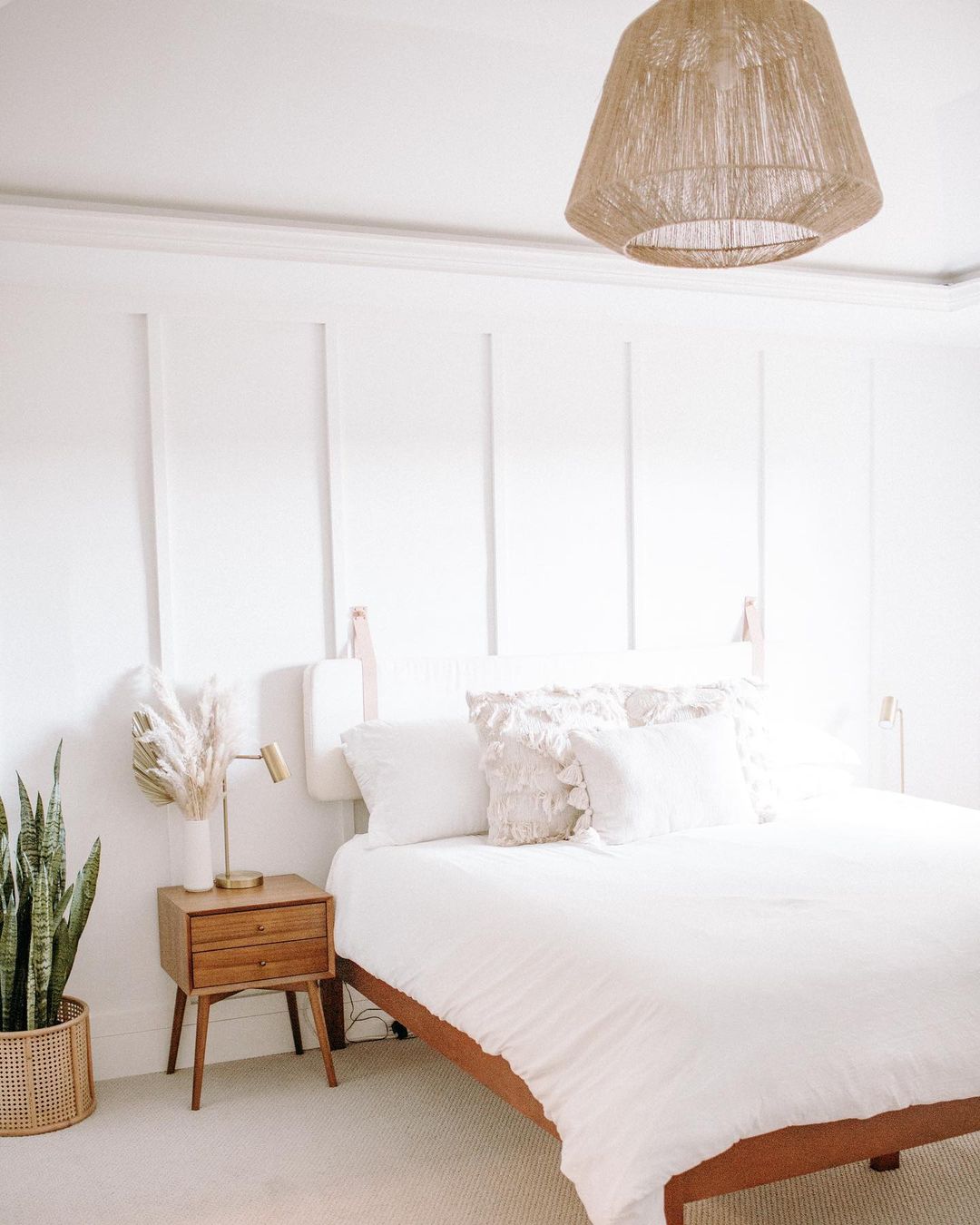 White bedroom with modern boho touches. Photo by Instagram User @lauriedicus
