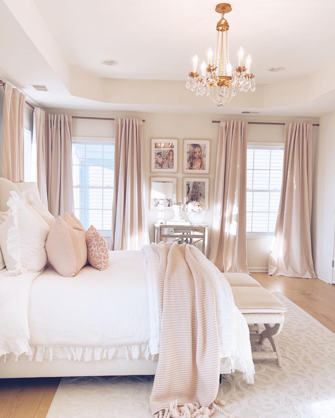 Soft pink bedroom with gold chandelier. Photo by Instagram User @the.pink.dream