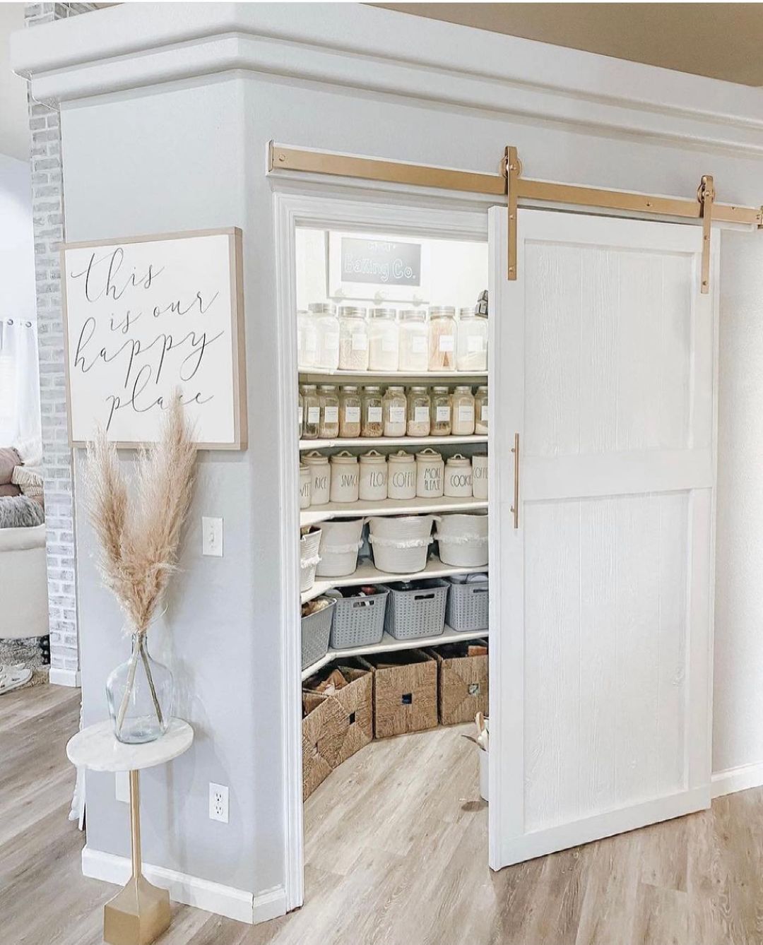 Kitchen Pantry with White Barn Door on Gold Sliders. Photo by Instagram user @beautifulinspire.co