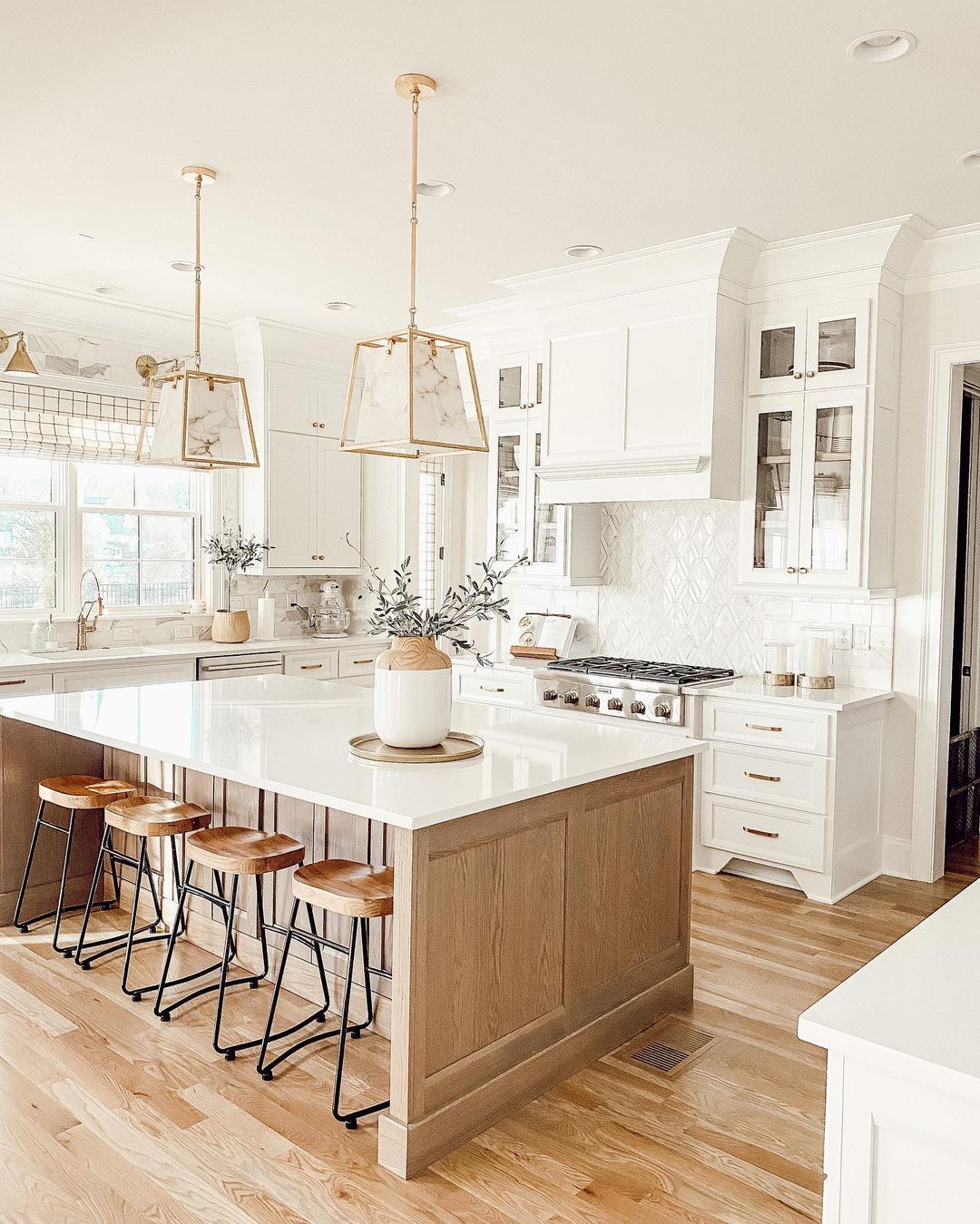Farmhouse Style Kitchen with White Cabinets and Walls. Photo by Instagram user @ourfauxfarmhouse