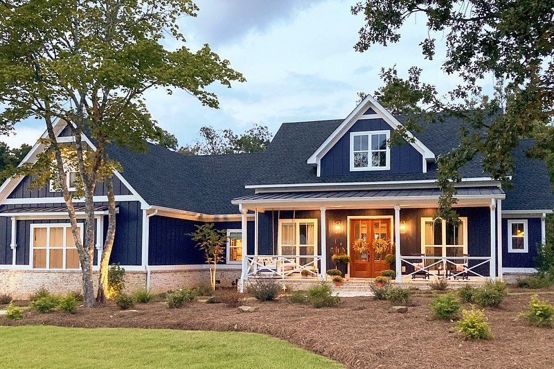 Traditional Style Farmhouse Painted Blue. Photo by Instagram user @adhouseplans