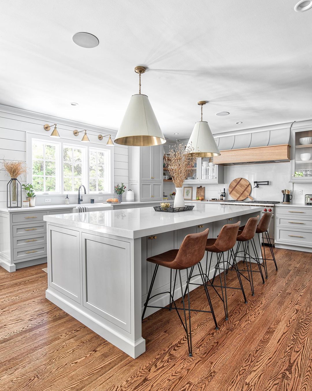 Gray Farmhouse Kitchen With Unique Lighting. Photo by Instagram user @chrisveithinteriors