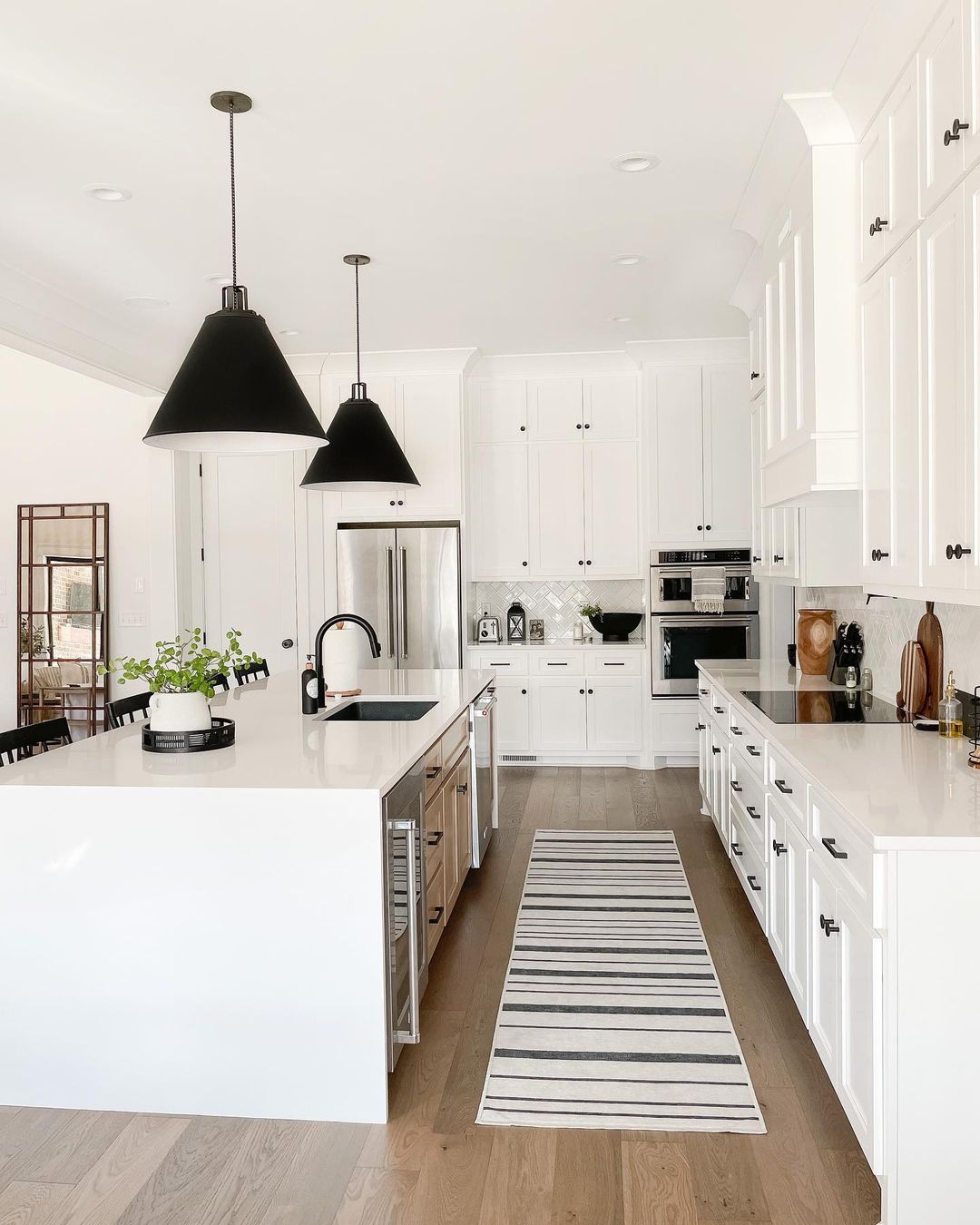 White Farmhouse Kitchen with Black Industrial Pulls. Photo by Instagram user @practical.designs