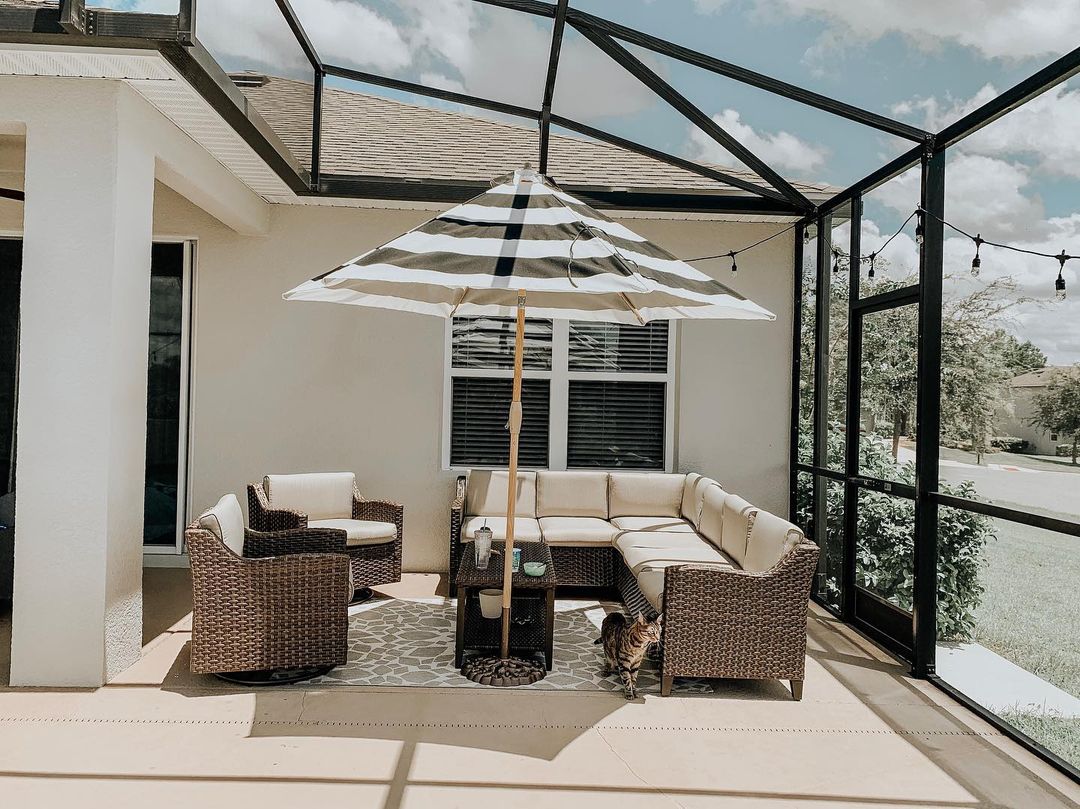 Backyard Patio with a Lanai Covering. Photo by Instagram user @southernconfetti